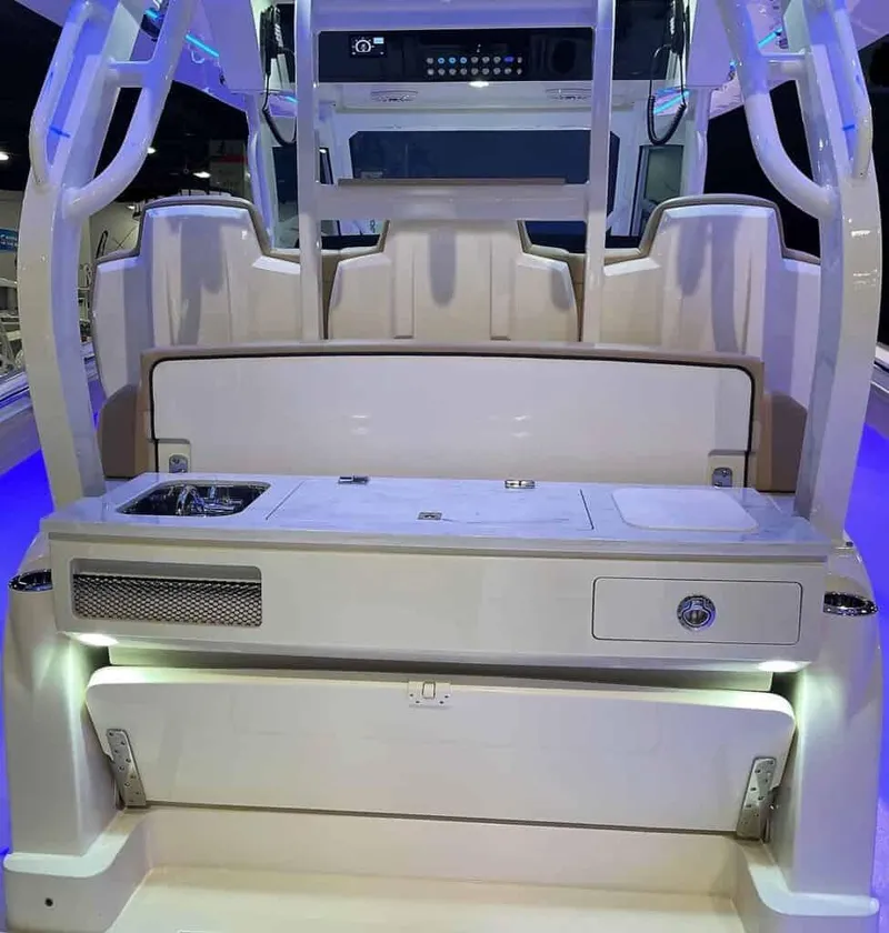 Slide: The Image of 2025 Scout 400 LXF boat interior with seating and control panel. - 26