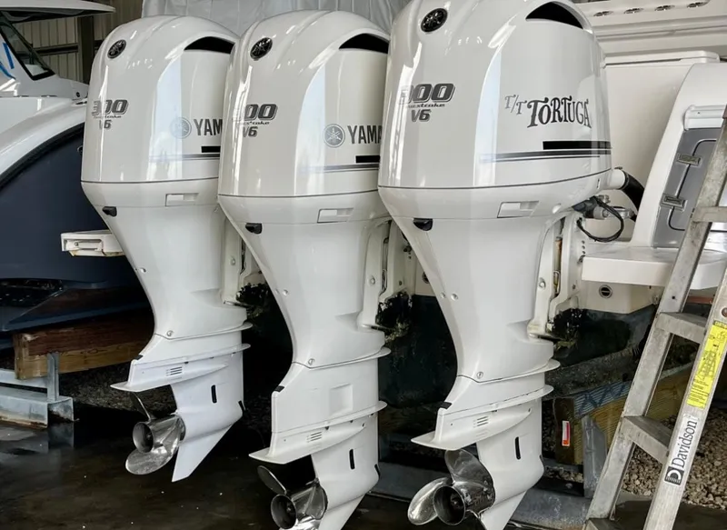 Slide: The Image of Triple Yamaha outboard engines on a 2015 Intrepid 375 Walkaround boat. - 11
