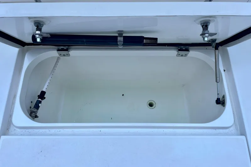 Slide: The Image of Open storage compartment on a 2015 Intrepid 375 Walkaround boat. - 29