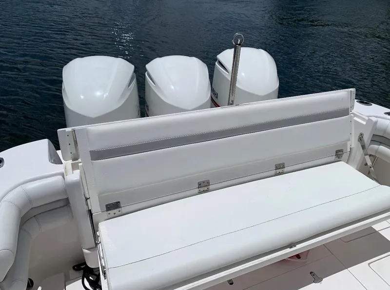 Slide: The Image of 2015 Intrepid 375 Walkaround boat with triple outboard engines and white seating. - 3