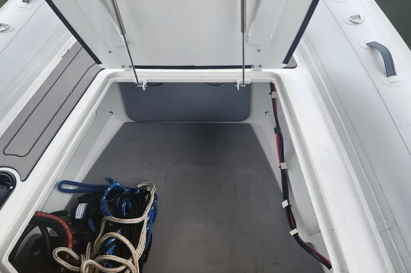 Slide: The Image of Open storage compartment in 2023 Highfield Sport 900 boat with ropes and cables. - 16