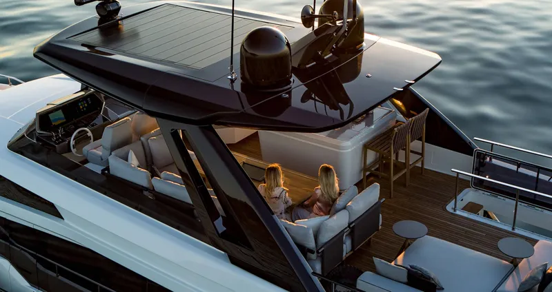 Slide: The Image of Luxury Ferretti Yachts 780, 2024 model, with elegant outdoor seating and ocean view. - 1