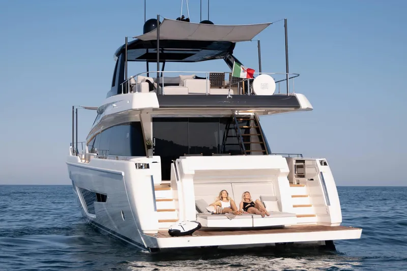 Slide: The Image of Ferretti Yachts 780 2024 model, luxury yacht with sunbathing area, cruising on open water. - 17