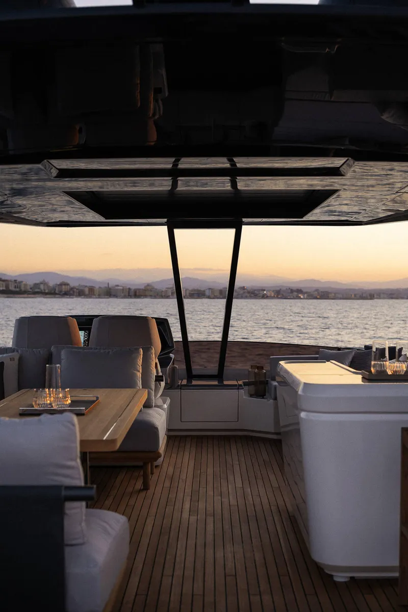 Slide: The Image of Luxurious interior of 2024 Ferretti Yachts 780 at sunset, featuring elegant seating and wooden flooring. - 21