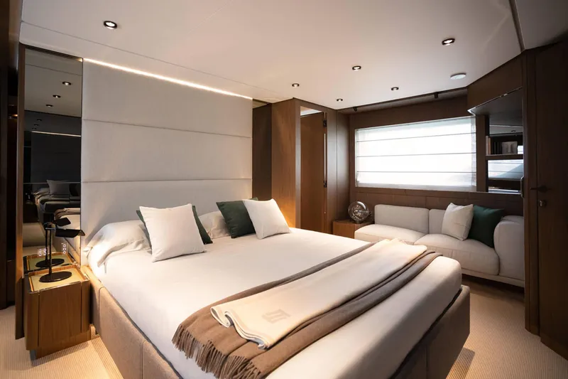 Slide: The Image of Luxurious bedroom interior of 2024 Ferretti Yachts 780 with modern design and cozy seating area. - 32