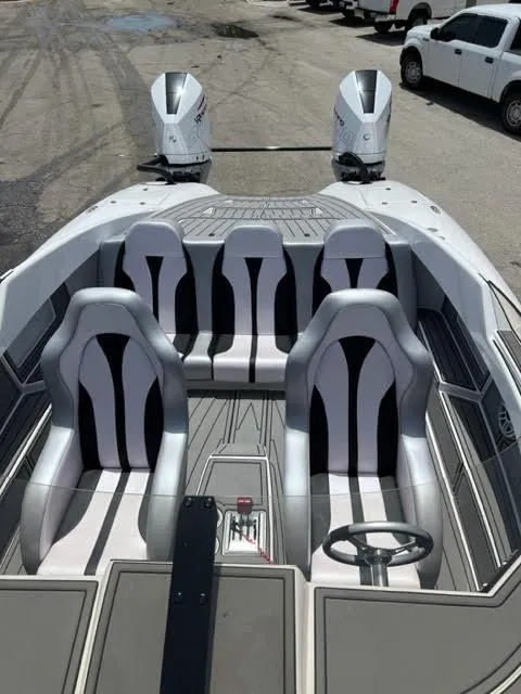 Slide: The Image of 2022 Doug Wright 32 Pleasure Cat boat interior with dual engines and modern seating. - 5