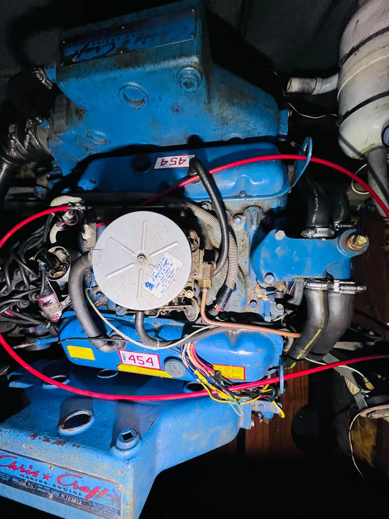 Slide: The Image of 1962 Chris-Craft Roamer engine, blue with red wiring, labeled "454." - 16