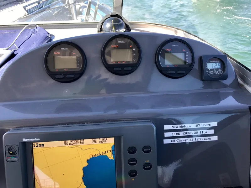Slide: The Image of Dashboard of a 2003 Protector Targa 28 boat with navigation instruments. - 12