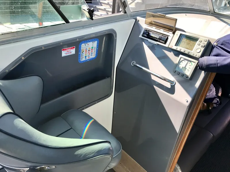 Slide: The Image of Interior of 2003 Protector Targa 28 boat with navigation equipment and seating. - 23