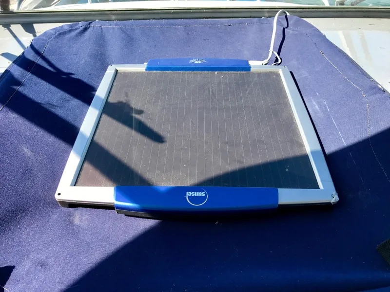 Slide: The Image of Solar panel on a 2003 Protector Targa 28 boat, placed on a blue surface. - 24