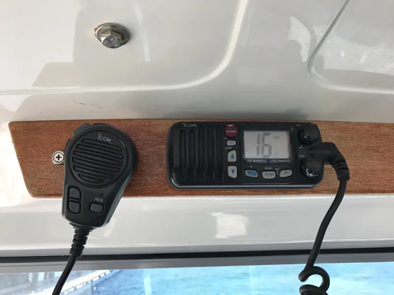 Slide: The Image of 2003 Protector Targa 28 boat radio equipment with microphone and display. - 26