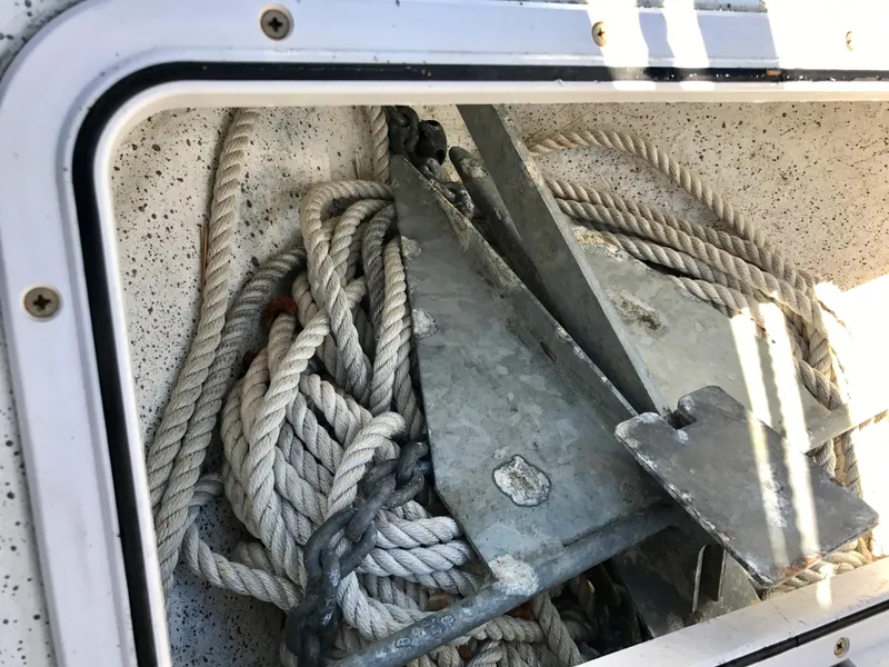 Slide: The Image of Anchor and ropes in a 2003 Protector Targa 28 storage compartment. - 30