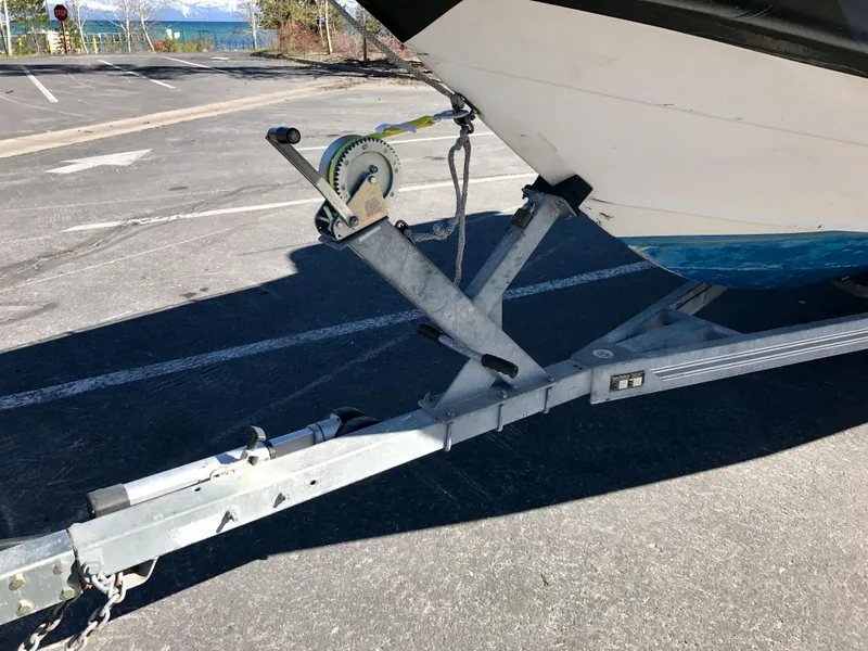 Slide: The Image of 2003 Protector Targa 28 boat on trailer, showing winch and hitch details. - 36