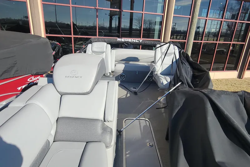 Slide: The Image of 2023 Regency 230 LE3 Sport boat interior with luxurious seating. - 4