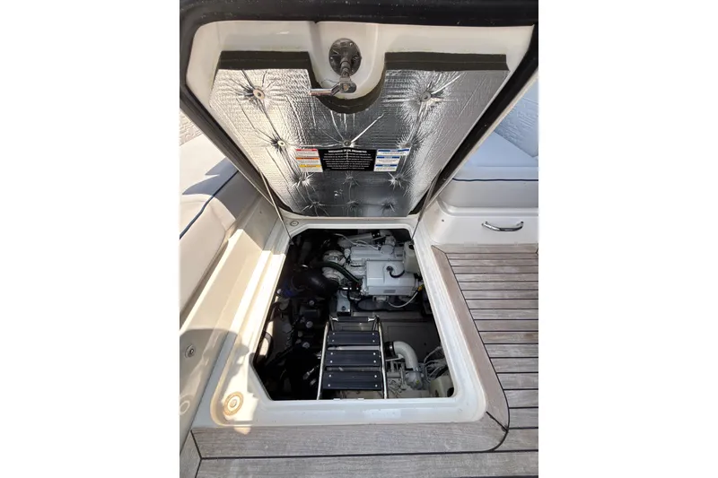 Slide: The Image of Engine compartment of 2018 Sea Ray Sundancer 510 yacht, showcasing mechanical components. - 113