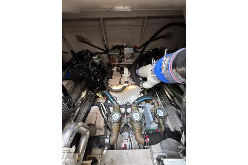 Slide: The Image of Engine room of a 2018 Sea Ray Sundancer 510 yacht, showcasing mechanical components. - 122