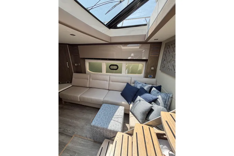 Slide: The Image of Luxurious interior of 2018 Sea Ray Sundancer 510 yacht with plush seating and cushions. - 130