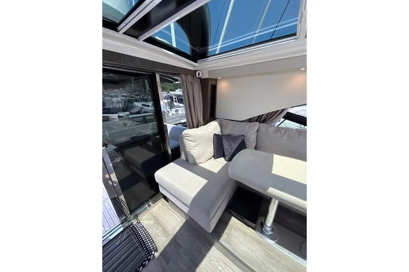 Slide: The Image of Luxurious interior of 2018 Sea Ray Sundancer 510 yacht with plush seating and skylight. - 106