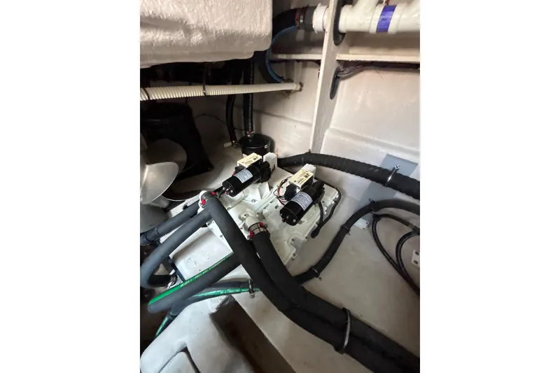 Slide: The Image of Engine room of 2018 Sea Ray Sundancer 510 with visible hoses and components. - 118