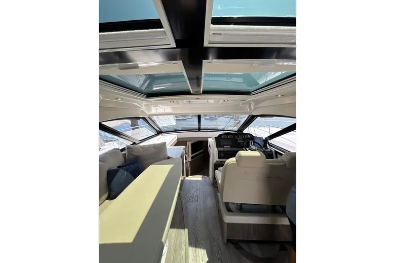Slide: The Image of Interior of 2018 Sea Ray Sundancer 510 yacht with sunroof and luxurious seating. - 108