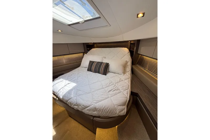 Slide: The Image of Luxurious bedroom interior of 2018 Sea Ray Sundancer 510 yacht with skylight and cozy bedding. - 131