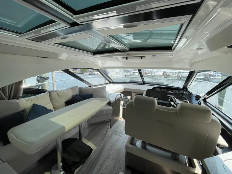 Slide: The Image of Interior of a 2018 Sea Ray Sundancer 510 with elegant seating area and panoramic windows. - 47