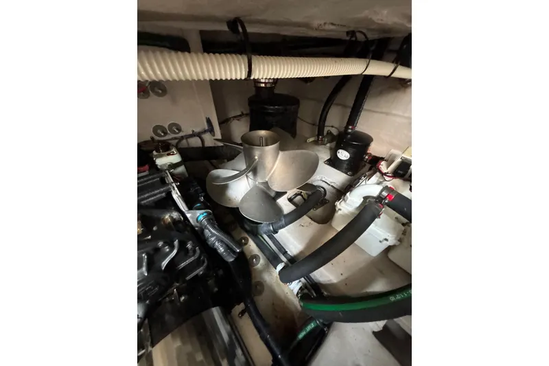 Slide: The Image of Engine room of 2018 Sea Ray Sundancer 510, showcasing mechanical components and propeller. - 120