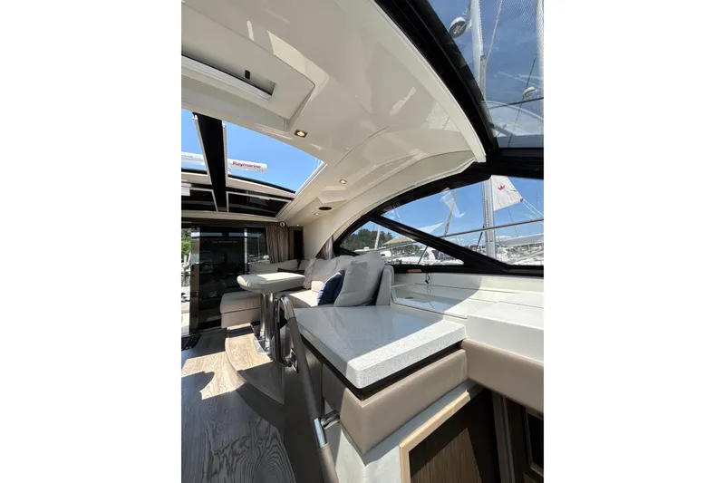 Slide: The Image of Luxurious interior of 2018 Sea Ray Sundancer 510 yacht with modern seating and sleek design. - 99