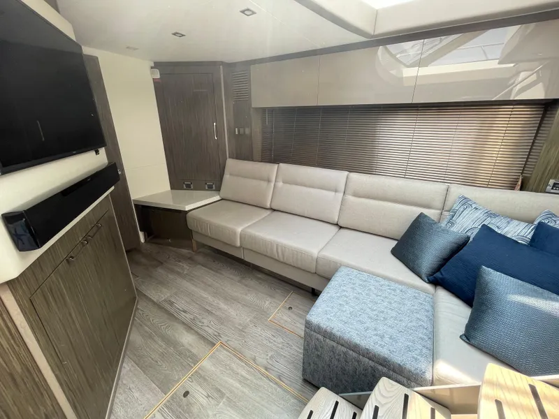 Slide: The Image of Interior of the 2018 Sea Ray Sundancer 510 with elegant seating area and modern design. - 56
