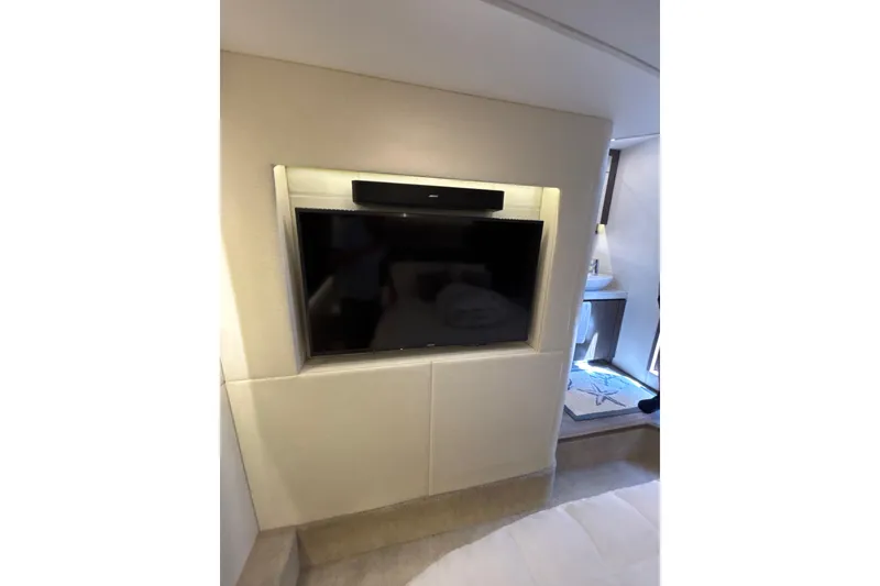 Slide: The Image of Luxurious interior of 2018 Sea Ray Sundancer 510 yacht with built-in TV and soundbar. - 140