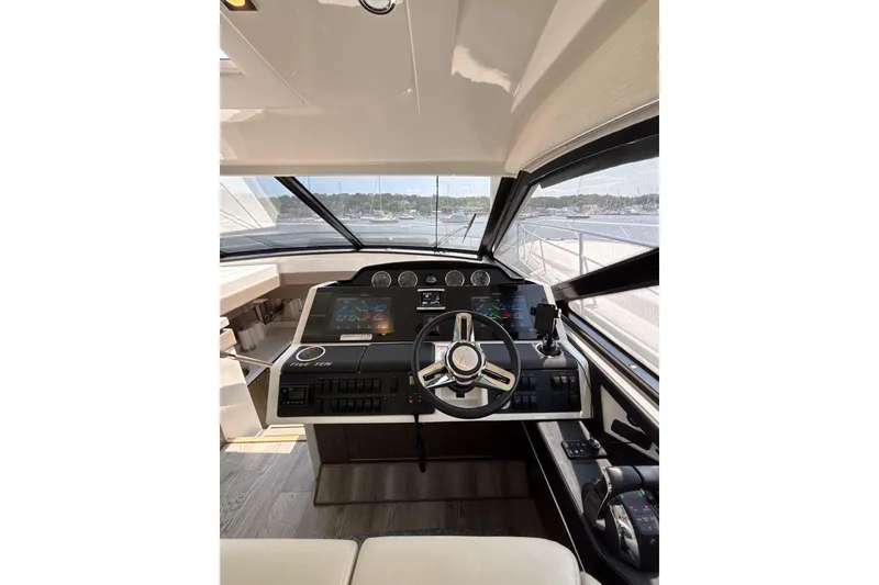 Slide: The Image of Helm of 2018 Sea Ray Sundancer 510 yacht with modern controls and navigation displays. - 103