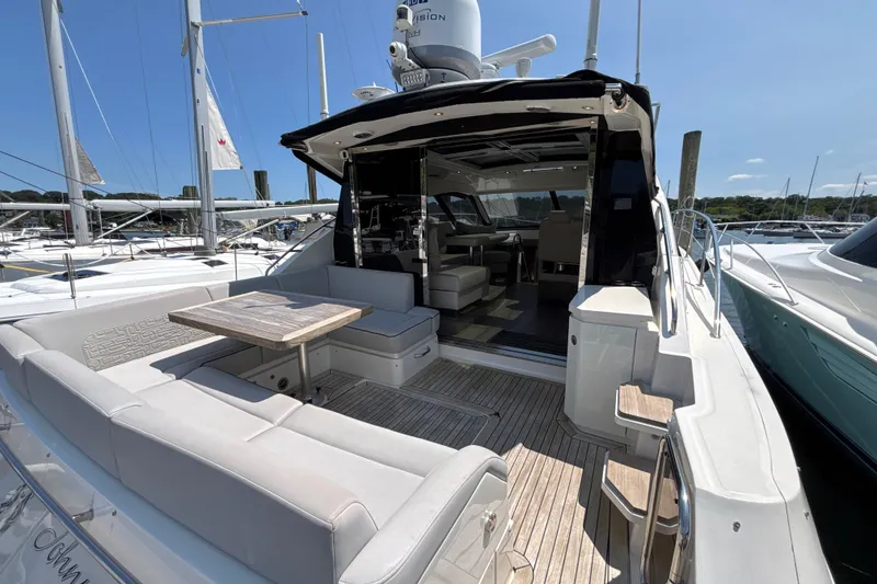 Slide: The Image of 2018 Sea Ray Sundancer 510 yacht with spacious deck and seating area. - 92