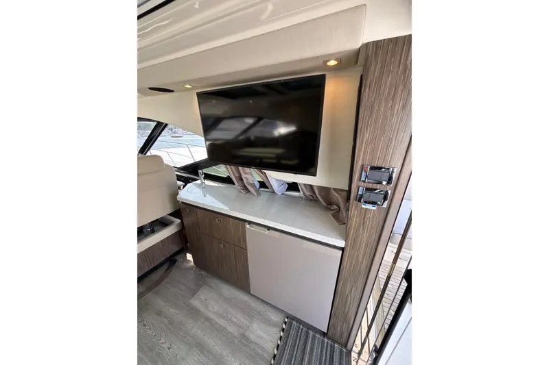 Slide: The Image of Interior of 2018 Sea Ray Sundancer 510 yacht with TV and modern cabinetry. - 102