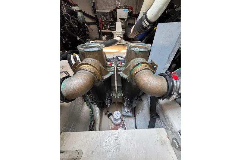 Slide: The Image of Engine room of 2018 Sea Ray Sundancer 510 with dual filters and piping system. - 116