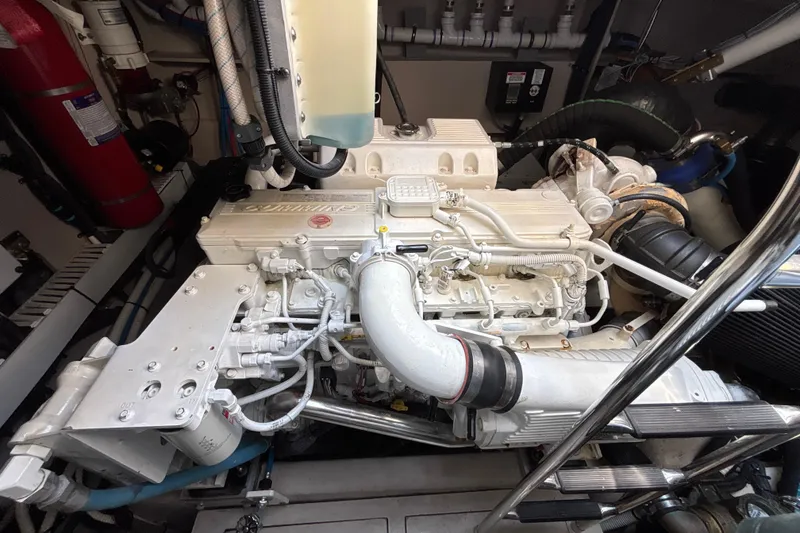Slide: The Image of Engine compartment of a 2018 Sea Ray Sundancer 510 yacht, showcasing detailed machinery. - 115