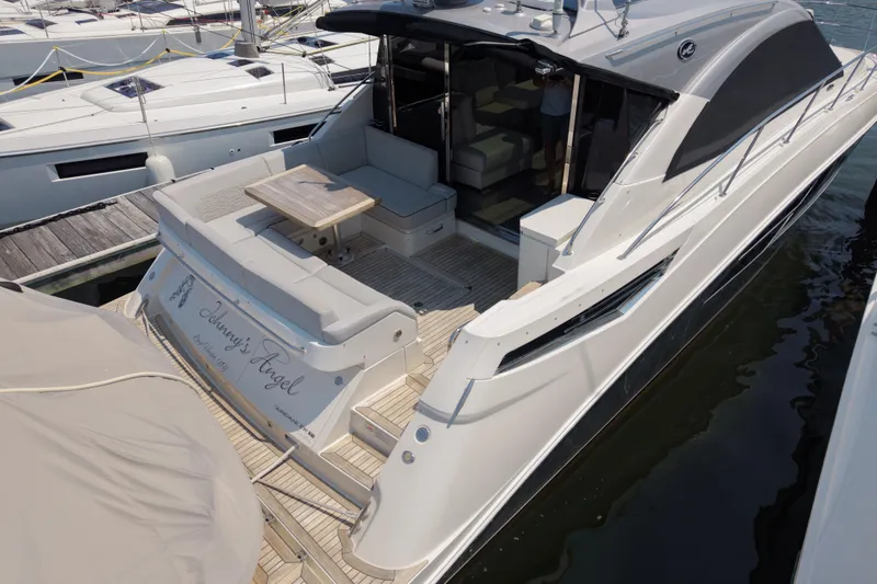 Slide: The Image of 2018 Sea Ray Sundancer 510 yacht docked, featuring spacious deck and elegant design. - 79