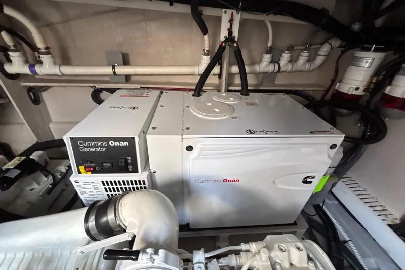 Slide: The Image of Cummins Onan generator in 2018 Sea Ray Sundancer 510 engine room, showcasing marine engineering. - 117
