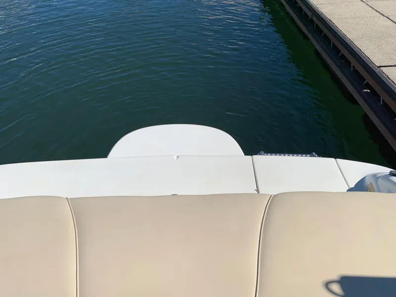 Slide: The Image of Sea Ray 210 Bow Rider 2000 boat stern view at dock. - 17