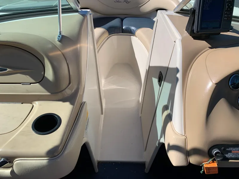 Slide: The Image of Interior of a 2000 Sea Ray 210 Bow Rider boat showing seating and console. - 18