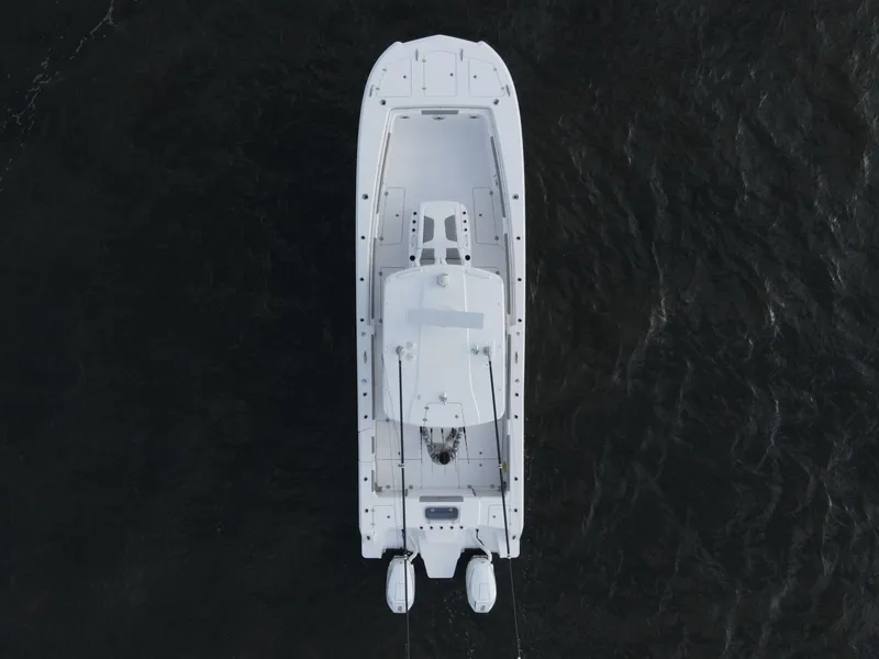 Slide: The Image of Aerial view of 2024 Caymas 34 CT boat on dark water. - 14
