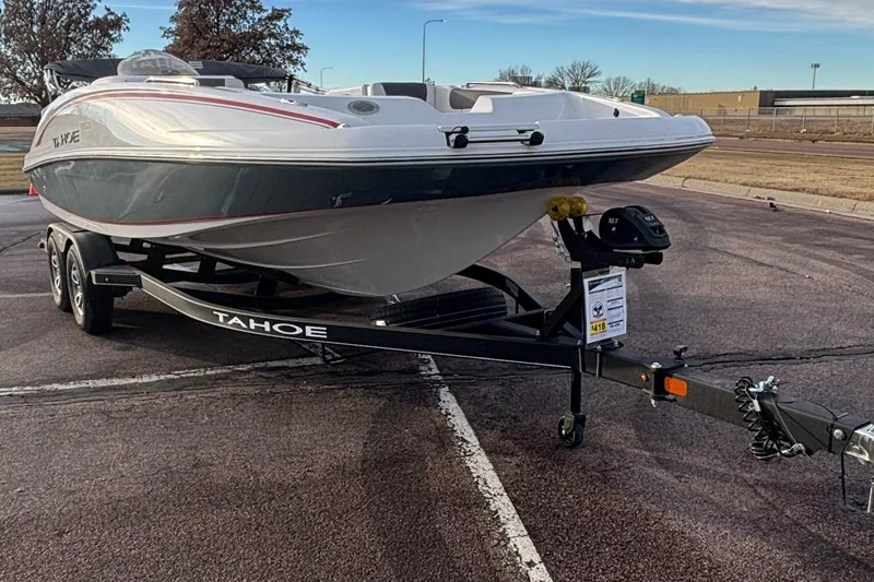 Slide: The Image of 2023 Tahoe 2150 boat on trailer in parking lot. - 3
