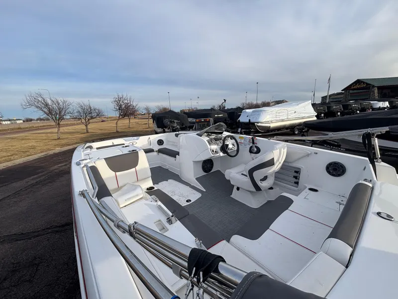 Slide: The Image of 2023 Tahoe 2150 boat interior with modern seating and steering wheel. - 9