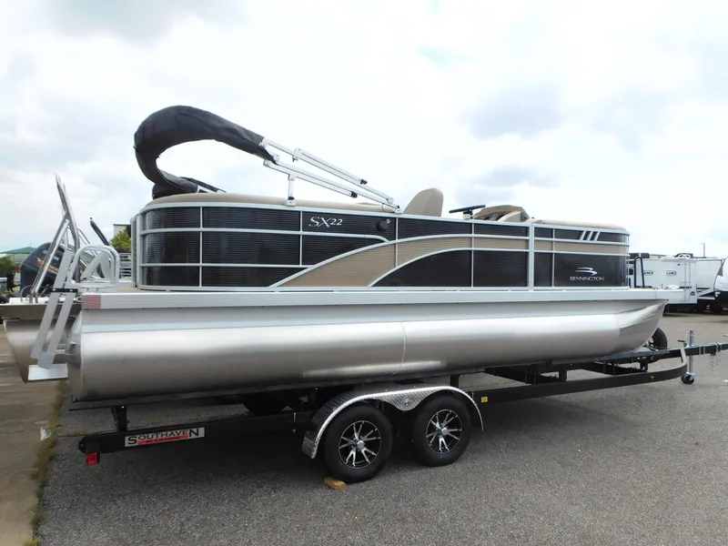 Slide: The Image of 2023 Bennington 22 SXSRC pontoon boat on a trailer. - 2