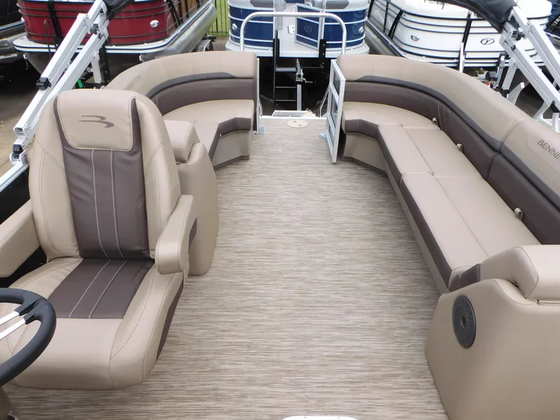 Slide: The Image of 2023 Bennington 22 SXSRC pontoon boat interior with beige and brown seating. - 4