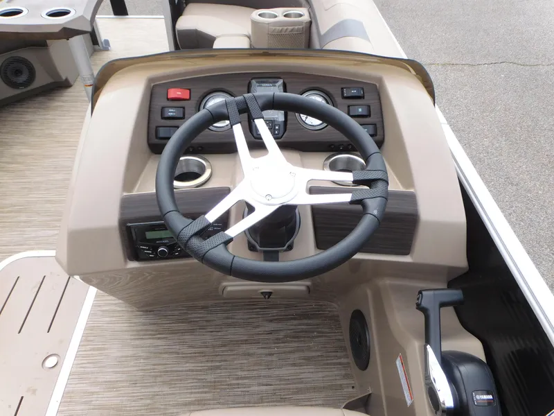 Slide: The Image of 2023 Bennington 22 SXSRC boat dashboard with steering wheel and controls. - 5