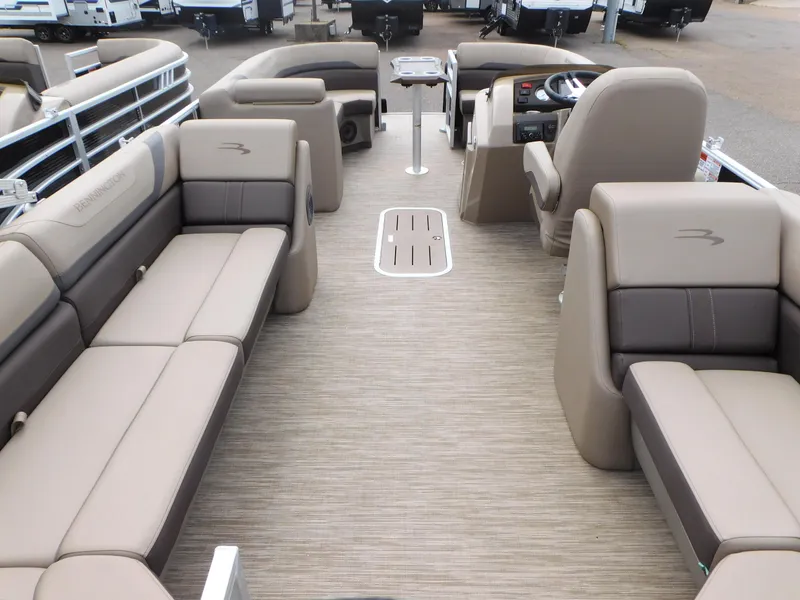 Slide: The Image of 2023 Bennington 22 SXSRC pontoon boat interior with beige and brown seating. - 7