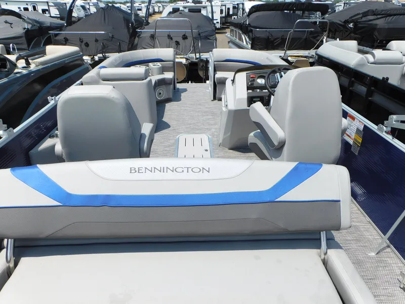 Slide: The Image of 2023 Bennington 22 SX Swingback pontoon boat interior with seating and helm. - 3