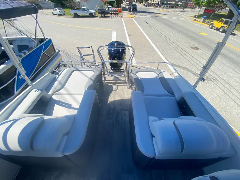 Slide: The Image of 2023 Godfrey Monaco 235 Rear Lounge pontoon boat with spacious seating and modern design. - 10