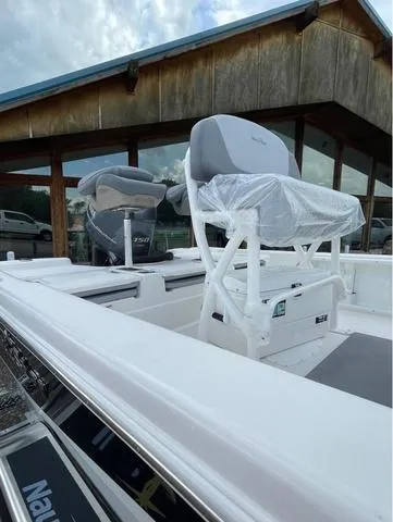 Slide: The Image of 2023 NauticStar 215 Bay boat with seating and console. - 4