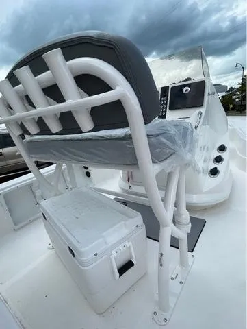 Slide: The Image of 2023 NauticStar 215 Bay boat with captain's chair and console. - 5